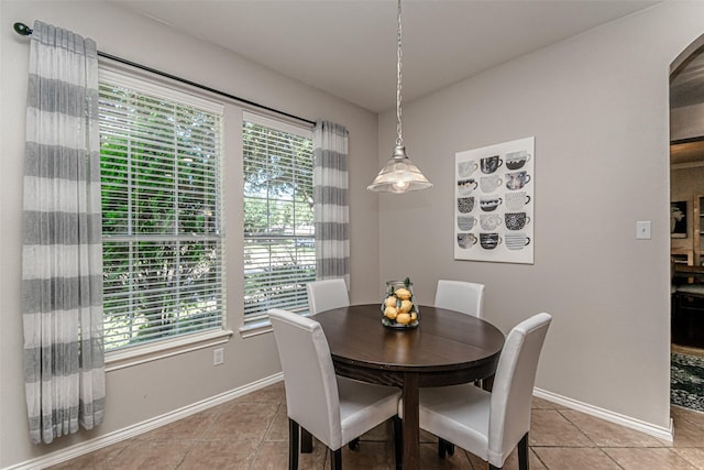 dining space with tile patterned floors