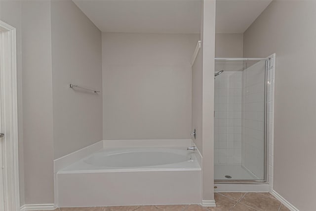 bathroom with tile patterned flooring and plus walk in shower