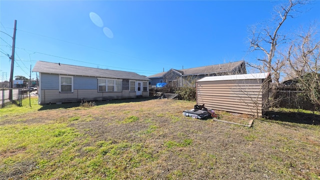 rear view of house with a lawn