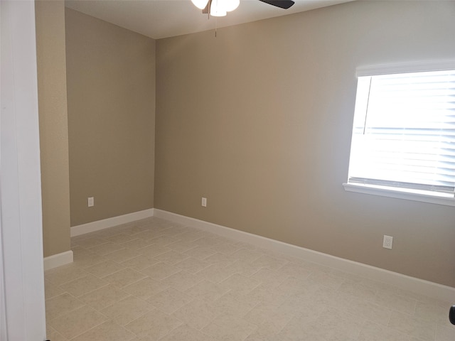 unfurnished room with ceiling fan