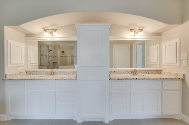 bathroom with vanity and walk in shower