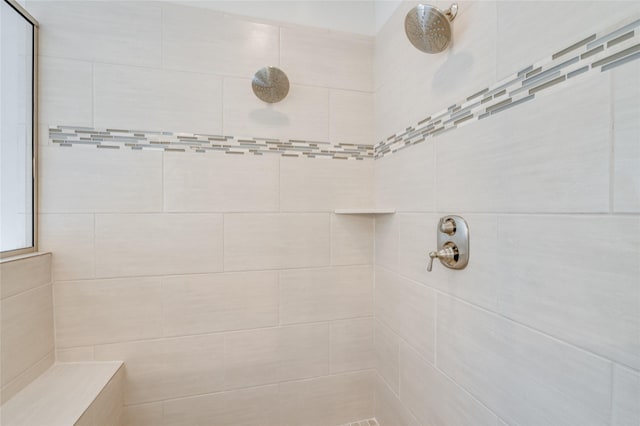 bathroom featuring tiled shower