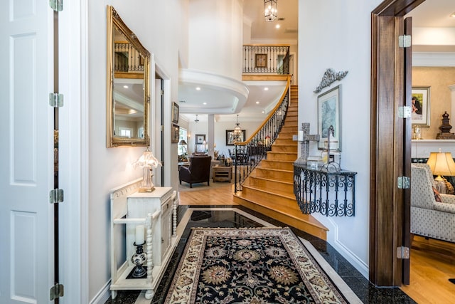 foyer entrance featuring crown molding