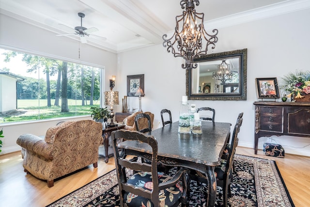 dining room with hardwood / wood-style flooring, ceiling fan with notable chandelier, and ornamental molding