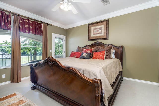 bedroom featuring multiple windows, ornamental molding, and ceiling fan