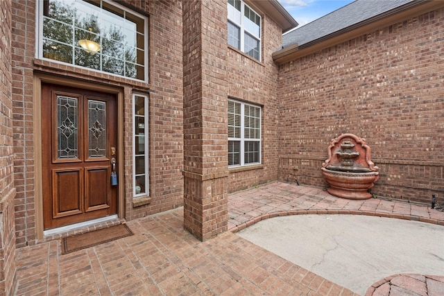 entrance to property with a patio area