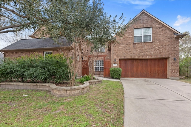 view of property with a garage and a front yard