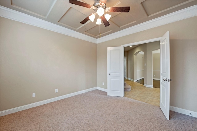 unfurnished bedroom featuring light carpet, crown molding, coffered ceiling, and ceiling fan