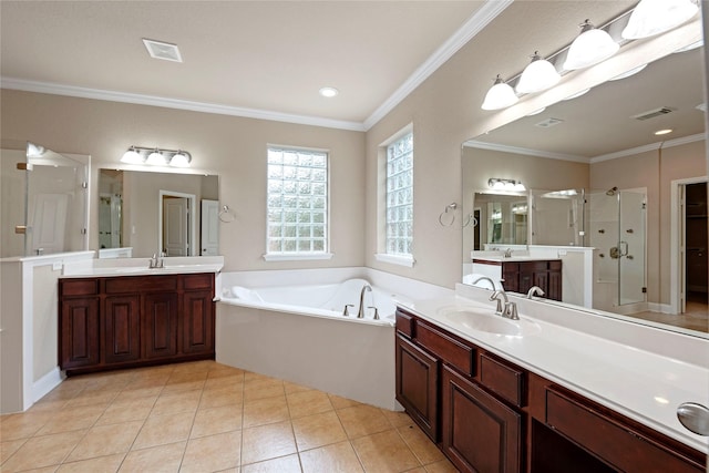 bathroom with ornamental molding, tile patterned floors, independent shower and bath, and vanity