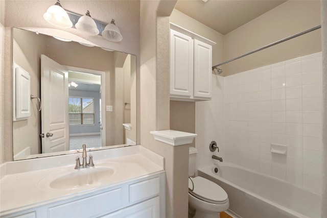 full bathroom featuring vanity, shower / bathtub combination, and toilet