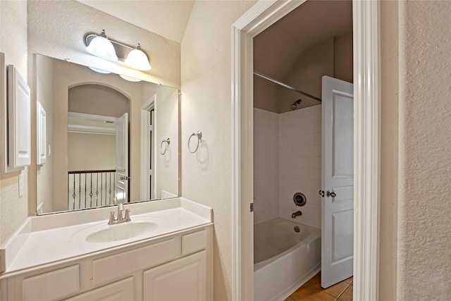 bathroom with vanity, tile patterned floors, and shower / bathtub combination