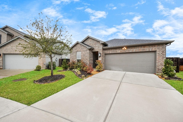 view of front facade featuring a garage and a front yard