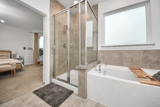 bathroom with plus walk in shower and tile patterned flooring