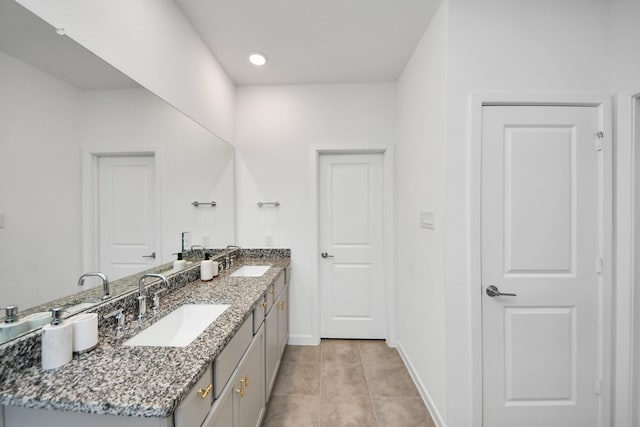 bathroom featuring tile patterned flooring and vanity