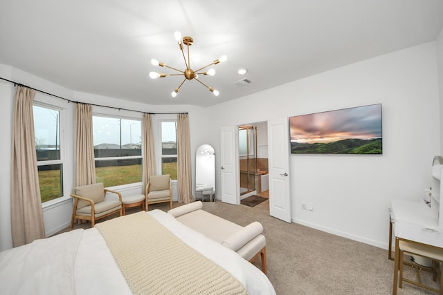 carpeted bedroom featuring a notable chandelier