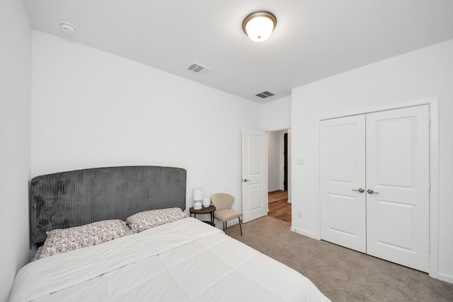 carpeted bedroom featuring a closet