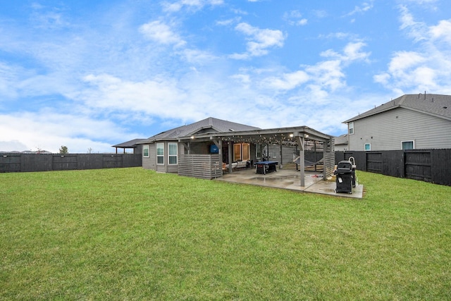 back of property featuring a yard and a patio area