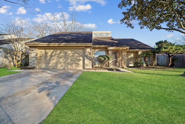 ranch-style house featuring a garage and a front yard