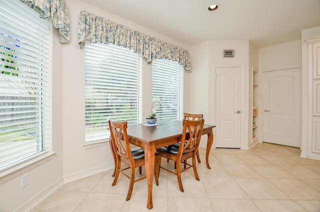 dining space featuring light tile patterned floors