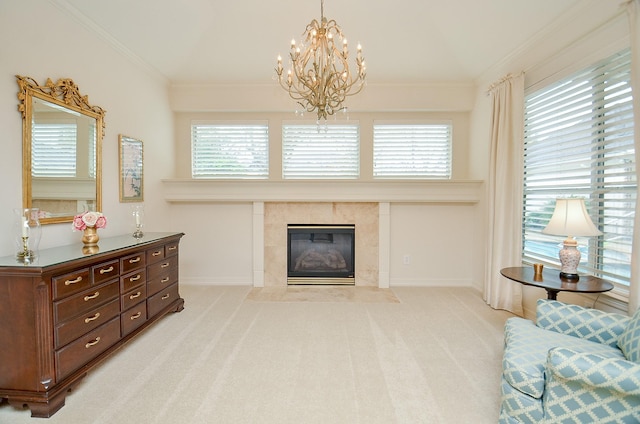 sitting room with a tile fireplace, crown molding, light colored carpet, and a notable chandelier