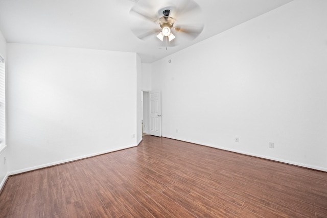 spare room featuring dark hardwood / wood-style floors and ceiling fan