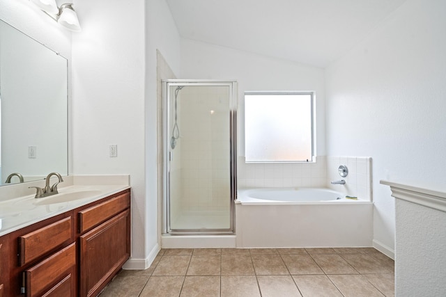 bathroom featuring lofted ceiling, vanity, tile patterned flooring, and independent shower and bath