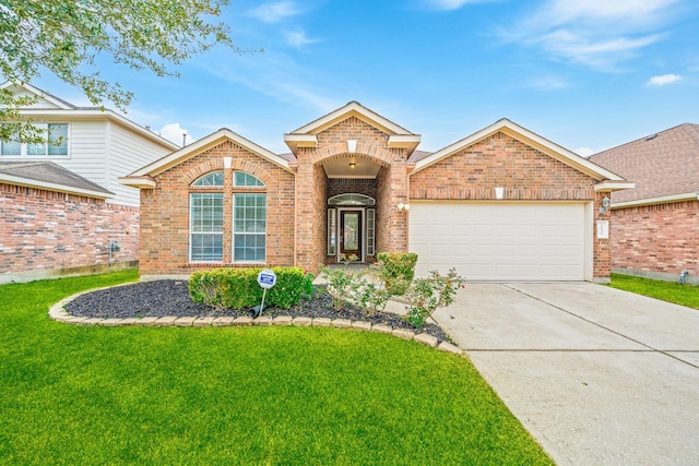 view of front property featuring a garage and a front yard