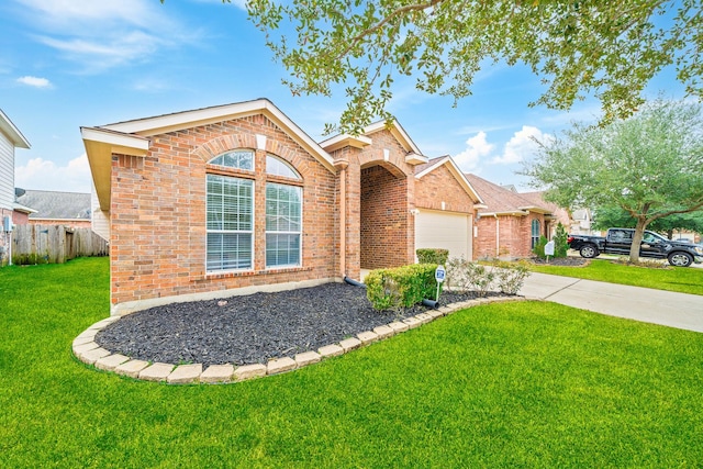 view of property with a garage and a front yard