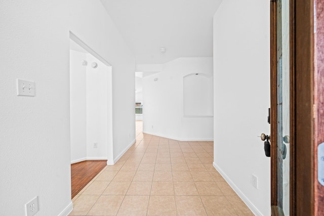 hallway with light tile patterned floors