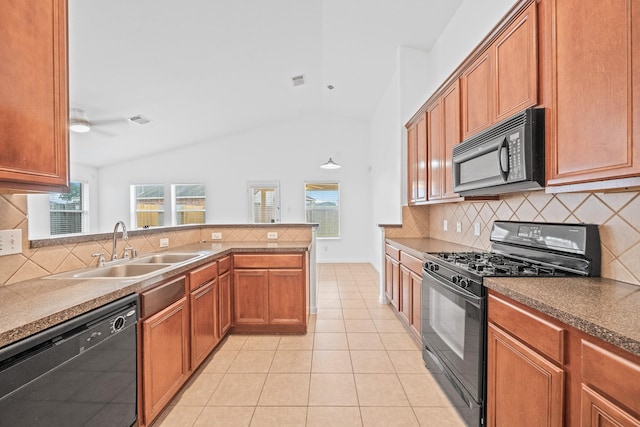 kitchen featuring sink, light tile patterned floors, plenty of natural light, black appliances, and vaulted ceiling