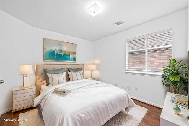 bedroom featuring dark hardwood / wood-style floors