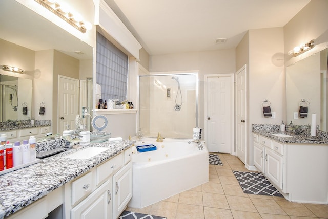 bathroom with vanity, plus walk in shower, and tile patterned flooring