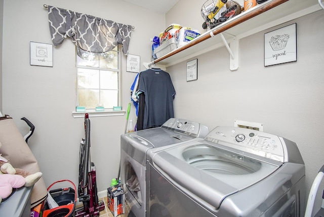 clothes washing area with washer and dryer