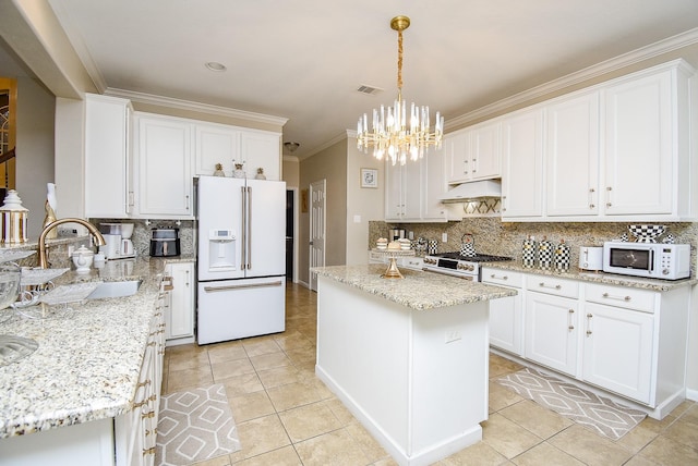 kitchen with sink, white cabinetry, light tile patterned floors, a kitchen island, and white appliances