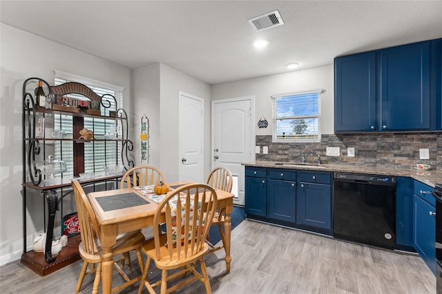 kitchen featuring sink, dishwasher, light stone countertops, blue cabinets, and light wood-type flooring