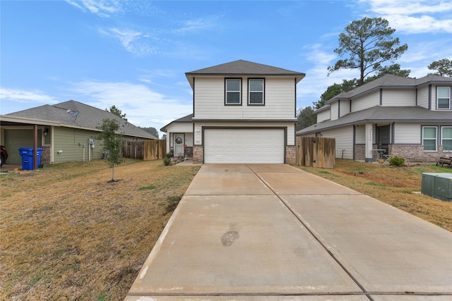 view of front of house featuring a garage and a front lawn