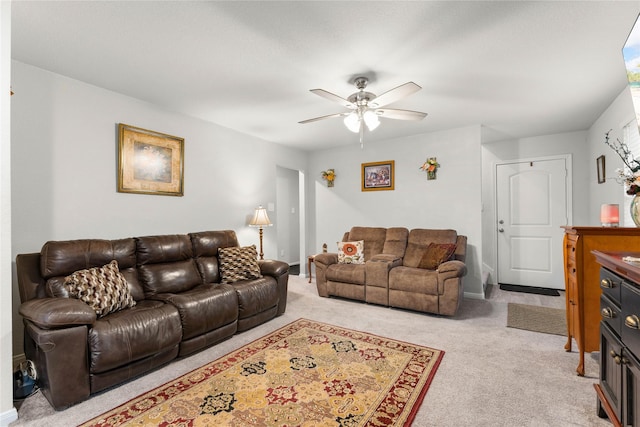 living room with light carpet and ceiling fan