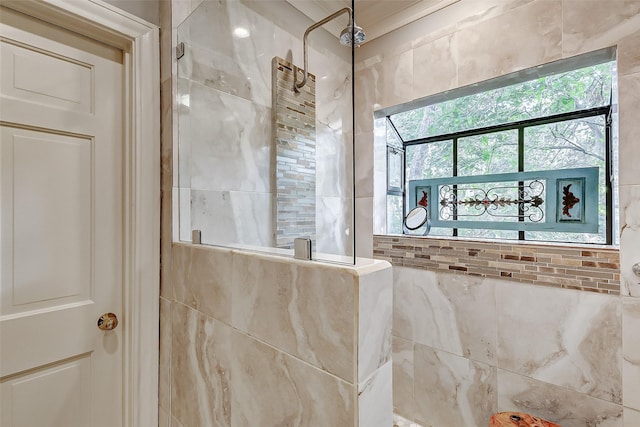 bathroom with tiled shower