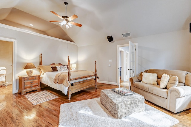 bedroom featuring lofted ceiling, hardwood / wood-style floors, and ceiling fan