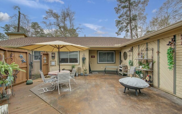 rear view of property with a wooden deck