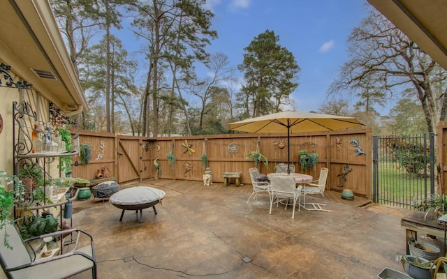 view of patio / terrace featuring a fire pit