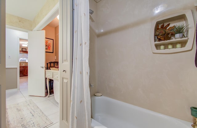 bathroom with tile patterned flooring and shower / bathing tub combination