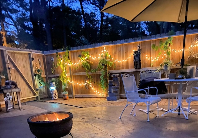 view of patio with a fire pit