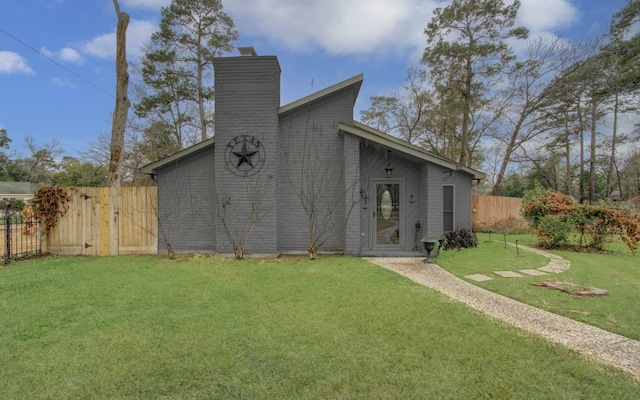 view of outbuilding featuring fence