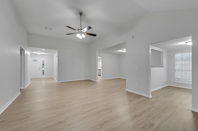 unfurnished living room with ceiling fan, lofted ceiling, and light hardwood / wood-style flooring