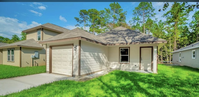 view of front facade with a garage and a front lawn