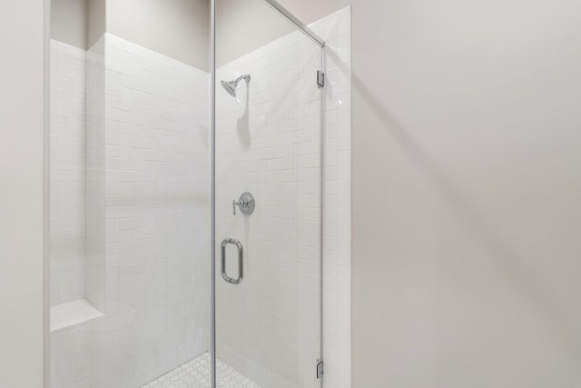 bathroom featuring an enclosed shower