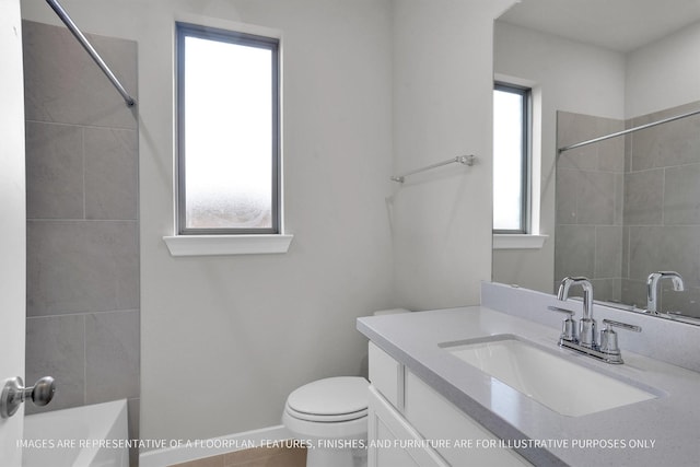 bathroom with baseboards, vanity, toilet, and shower / bathtub combination