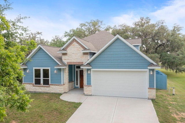 craftsman-style home with a garage and a front yard