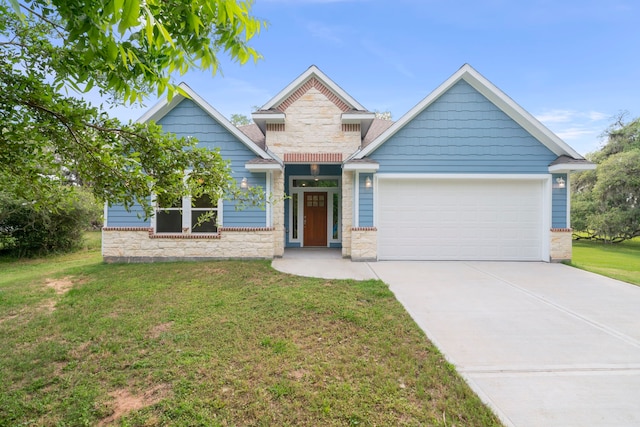 craftsman-style house with a garage and a front lawn